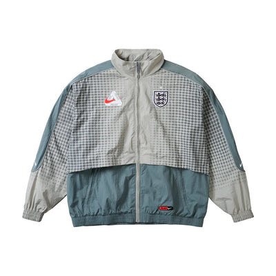 Veste de survêtement Palace x Nike England Solo Swoosh – Gris étain/Gris froid (PE26)